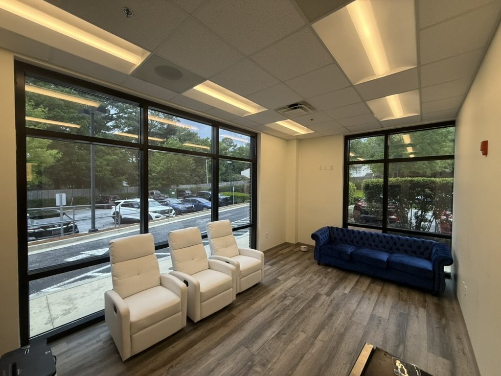 The same corner office after heat and privacy film, glare gone and the view intact